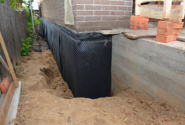 SJ Waterproofing Pros technician performing targeted Foundation Crack Repair assessment in Munster, IN